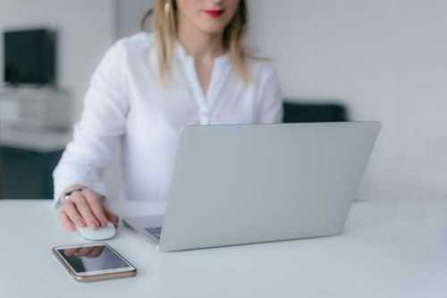 woman looking at a laptop