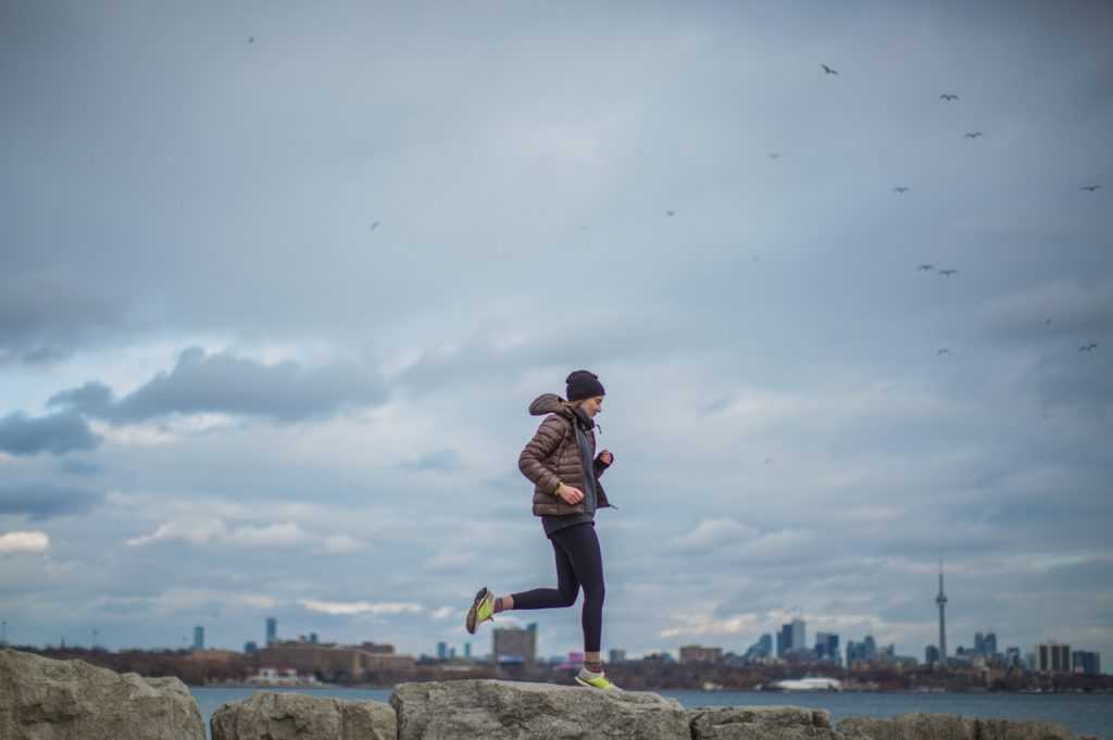 woman running with lots of sky in the background