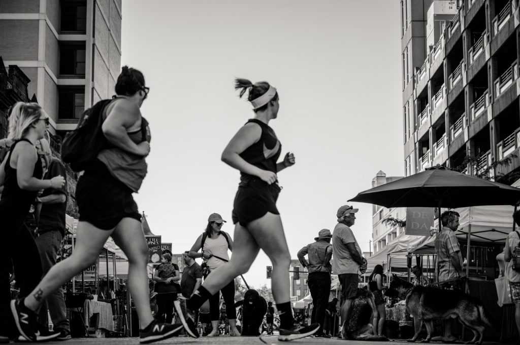 woman running in a road race