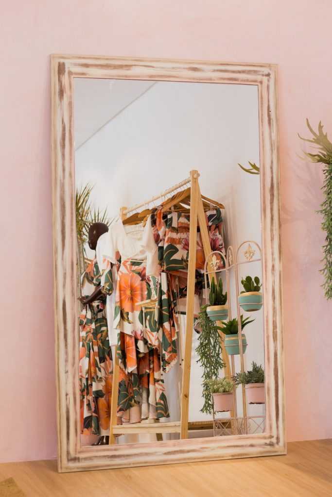 mirror showing clothing for sale