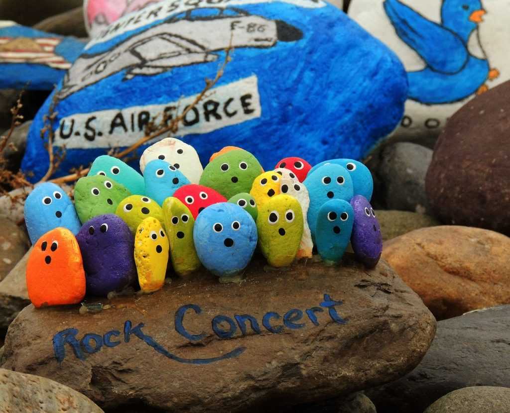 painted rocks in the shape of a concert